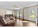 Spacious living room with hardwood floors and brown reclining sofas at 2063 Knight St, Creedmoor, NC 27522