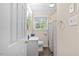 Bathroom with shower/tub combo and gray patterned curtain at 2063 Knight St, Creedmoor, NC 27522
