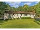 Ranch home with landscaped lawn and mature trees at 2063 Knight St, Creedmoor, NC 27522