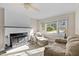 Cozy living room with fireplace and neutral colored furniture at 2063 Knight St, Creedmoor, NC 27522