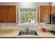 Kitchen sink with a window overlooking the backyard at 2063 Knight St, Creedmoor, NC 27522