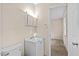 Simple bathroom with a white vanity and toilet at 2063 Knight St, Creedmoor, NC 27522