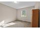 Bedroom with wood floors and a large window at 2063 Knight St, Creedmoor, NC 27522