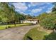 Home with a long driveway and lush landscaping at 2063 Knight St, Creedmoor, NC 27522