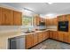 Kitchen with wood cabinets, tile backsplash and stainless steel appliances at 2063 Knight St, Creedmoor, NC 27522