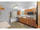 Kitchen with wood cabinets, tile backsplash, and an island at 2063 Knight St, Creedmoor, NC 27522
