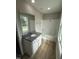 Bathroom boasts a granite countertop vanity and a bathtub at 54 Bonsai Way, Four Oaks, NC 27524