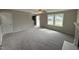 Spacious living room with fireplace and carpet flooring at 54 Bonsai Way, Four Oaks, NC 27524