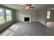 Bright living room with fireplace and neutral walls at 54 Bonsai Way, Four Oaks, NC 27524