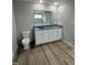 Double vanity bathroom with granite countertop at 54 Bonsai Way, Four Oaks, NC 27524