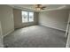 Large bedroom with carpeted floor and ceiling fan at 54 Bonsai Way, Four Oaks, NC 27524
