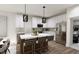 Modern kitchen with stainless steel appliances and a large island at 2413 Adrift Rd, Fuquay Varina, NC 27526