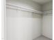 Walk-in closet with double hanging rods and shelving at 2413 Adrift Rd, Fuquay Varina, NC 27526