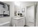 Well-lit bathroom with single vanity and access to hallway at 2413 Adrift Rd, Fuquay Varina, NC 27526