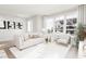 Bright and airy living room featuring a comfortable sofa and plenty of natural light at 2413 Adrift Rd, Fuquay Varina, NC 27526