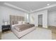 Main bedroom with plush bed, nightstand, and walk-in closet at 3024 White Rail Dr, Fuquay Varina, NC 27526
