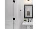 Elegant bathroom with pedestal sink and black matte fixtures at 2411 Adrift Rd, Fuquay Varina, NC 27526