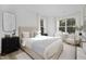 Bedroom with window seat, comfortable bed and hardwood floors at 2411 Adrift Rd, Fuquay Varina, NC 27526