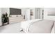 Bright bedroom with large bed, dresser and TV at 2415 Adrift Rd, Fuquay Varina, NC 27526