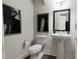 Modern bathroom with pedestal sink, toilet and frameless shower at 2415 Adrift Rd, Fuquay Varina, NC 27526