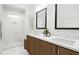 Elegant bathroom with dual vanity and walk-in shower at 2415 Adrift Rd, Fuquay Varina, NC 27526