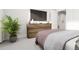 Well-lit bedroom featuring a dresser and a comfy bed at 2415 Adrift Rd, Fuquay Varina, NC 27526