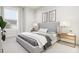 Serene bedroom with gray upholstered bed and nightstands at 2415 Adrift Rd, Fuquay Varina, NC 27526