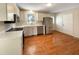 Kitchen with hardwood floors, stainless steel appliances, and white cabinets at 27 Pine Croft Rd, Angier, NC 27501