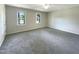 Spacious bedroom with neutral carpeting and ample natural light at 27 Pine Croft Rd, Angier, NC 27501