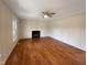 Living room with hardwood floors and fireplace at 27 Pine Croft Rd, Angier, NC 27501