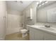 Bathroom features a white vanity, a bathtub, and neutral tile flooring at 27 Pine Croft Rd, Angier, NC 27501