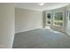 Bright bedroom with bay window, neutral wall paint, and carpeted floors at 27 Pine Croft Rd, Angier, NC 27501