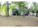 Gray house back with deck and wooded backyard at 3404 Gemini Dr, Raleigh, NC 27604