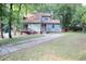 Two-story house with wood siding, deck, and driveway at 3404 Gemini Dr, Raleigh, NC 27604