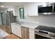Modern kitchen with stainless steel appliances and granite countertops at 3404 Gemini Dr, Raleigh, NC 27604