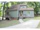 House exterior with a walkway and surrounding trees at 3404 Gemini Dr, Raleigh, NC 27604