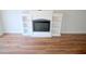 Living room with fireplace and built-in shelving at 3404 Gemini Dr, Raleigh, NC 27604