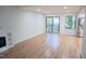 Living room with hardwood floors and sliding glass doors to deck at 3404 Gemini Dr, Raleigh, NC 27604