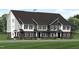 Modern three-story townhome with dark brick and light siding at 2413 Adrift Rd, Fuquay Varina, NC 27526