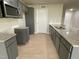Modern kitchen with gray cabinets and granite countertops at 53 Grace Ridge Ct, Benson, NC 27504