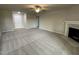 Spacious living room featuring a fireplace and carpet flooring at 53 Grace Ridge Ct, Benson, NC 27504
