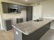 Modern kitchen with gray cabinets and granite countertops at 53 Grace Ridge Ct, Benson, NC 27504