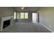 Living room with fireplace and access to patio at 95 Grace Ridge Ct, Benson, NC 27504