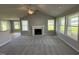 Spacious living room featuring a fireplace and large windows at 95 Grace Ridge Ct, Benson, NC 27504