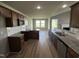Kitchen with granite countertops, breakfast bar, and view to living area at 95 Grace Ridge Ct, Benson, NC 27504