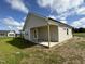 House exterior showcasing a covered patio and neutral siding at 95 Grace Ridge Ct, Benson, NC 27504