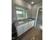 Double vanity bathroom with granite countertop and large mirror at 95 Grace Ridge Ct, Benson, NC 27504