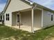 House exterior with covered patio at 247 Mahogany Way, Four Oaks, NC 27524