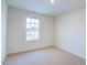Bright bedroom with window, carpet, and neutral walls at 1905 Puffin Dr # 196, Haw River, NC 27258