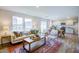 Open living room and kitchen with hardwood floors and lots of natural light at 1905 Puffin Dr # 196, Haw River, NC 27258